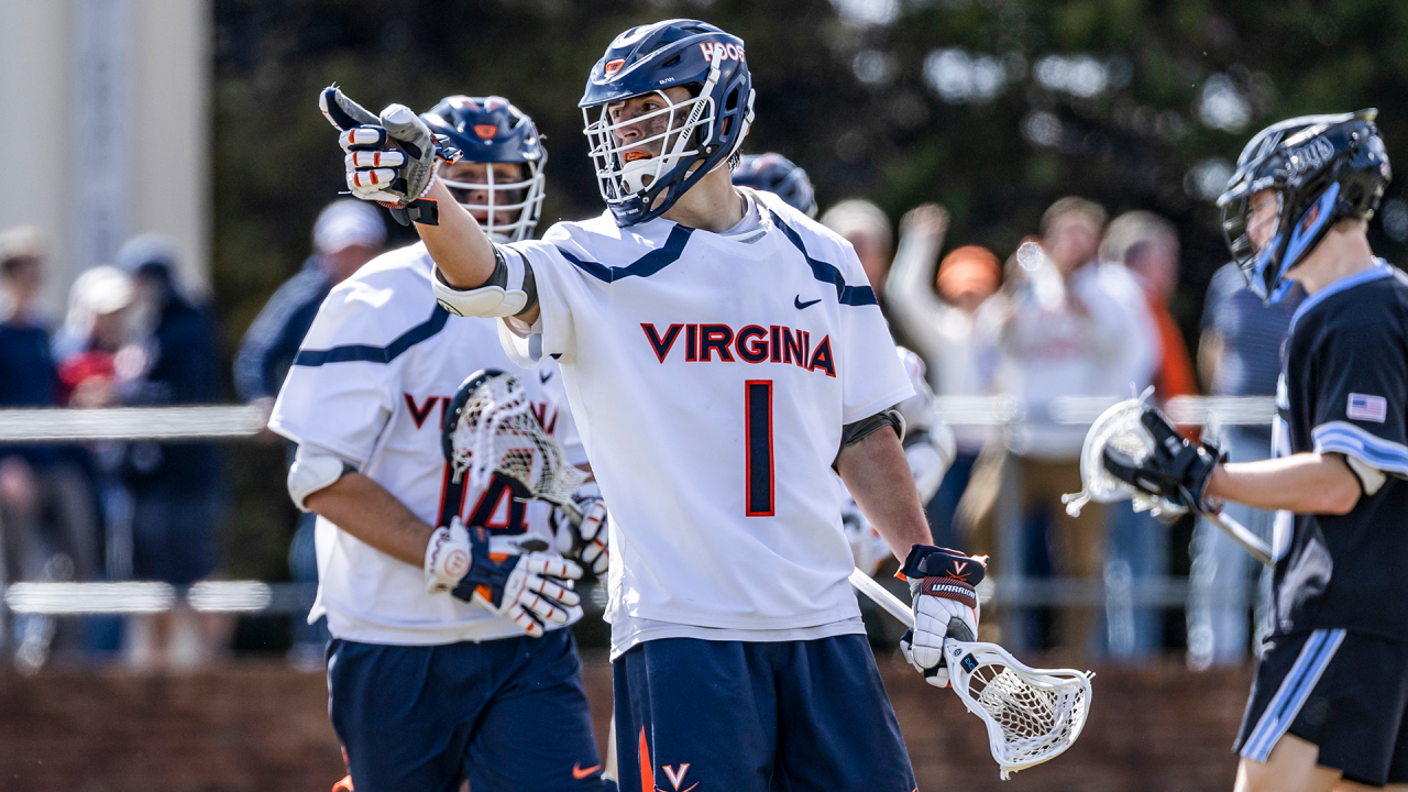 Connor Shellenberger points to a teammate after scoring during Virginia's game against Johns Hopkins earlier this season.