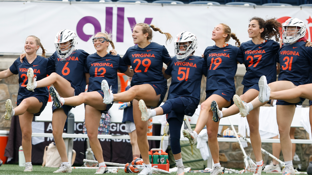 The Virginia bench celebrates a goal.