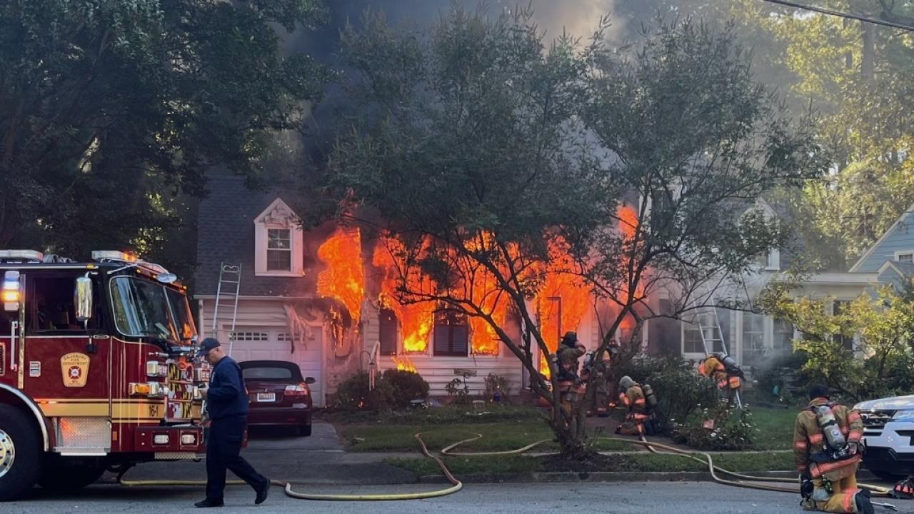 Firefighters work to extinguish the blze at Berkman's house in Salisbury's Pinehurst neighborhood Oct. 8, 2023.