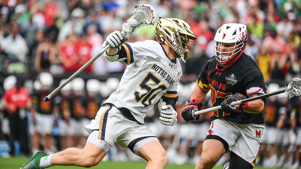 Notre Dame attackman Chris Kavanagh (50) sprints past Maryland long pole Will SchallerHear how to pronounce Will Schaller in NCAA championship game action at Lincoln Financial Field in Philadelphia.