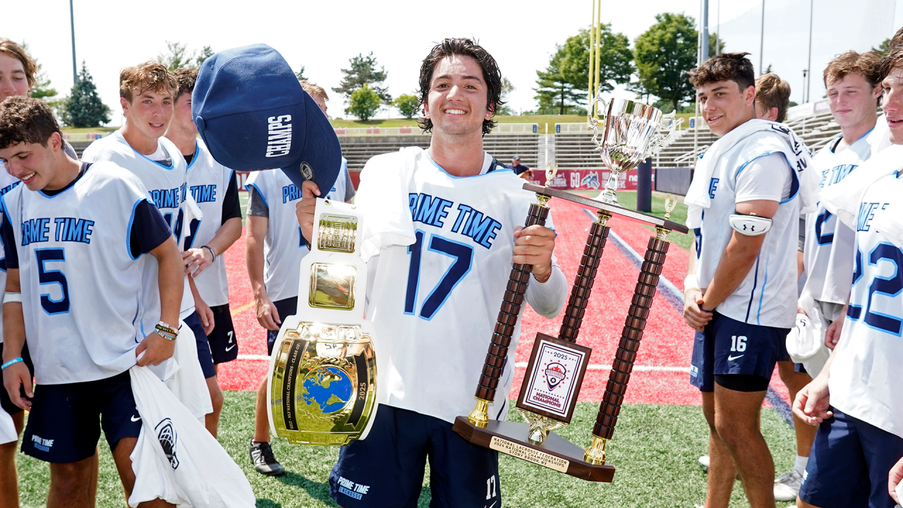 Prime Time 2025 goalie Ty Ramachandran with the MVP belt and the NLF National Championship trophy