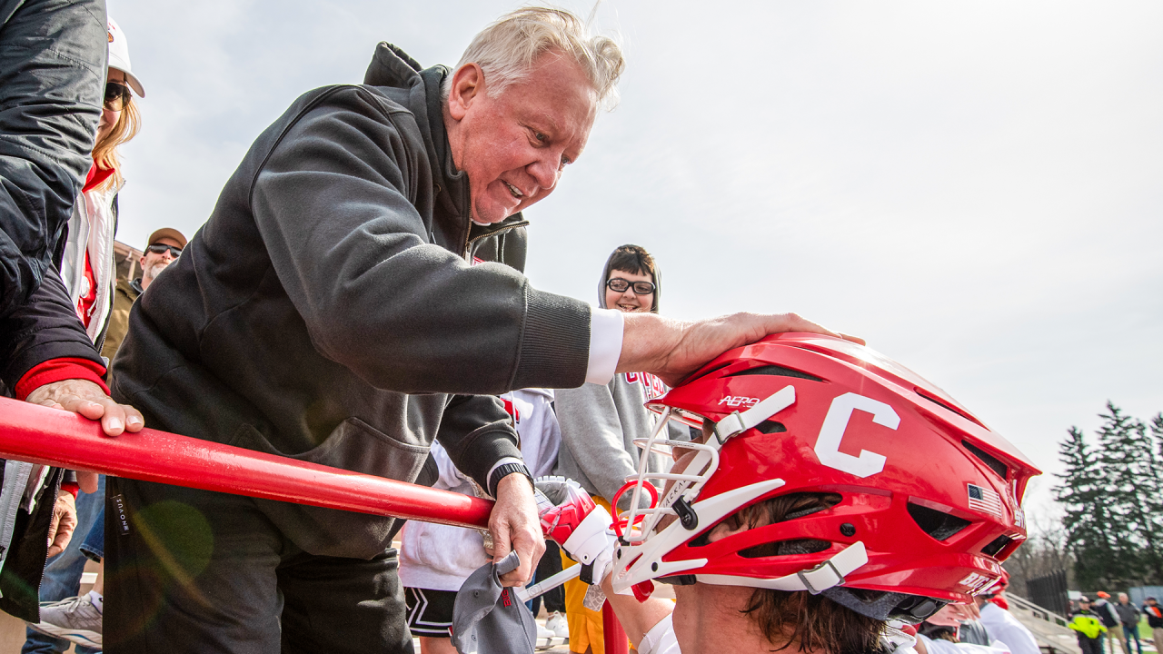 Hall of Famer Mike French congratulates CJ Kirst after Kirst broke French's Cornell record for career goals.