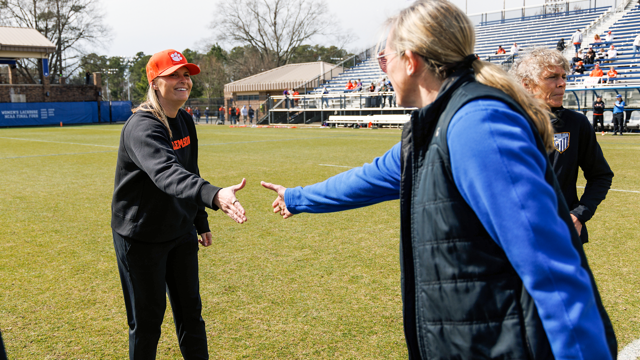 Clemson's Alison Kwolek and Duke's Kerstin Kimel shake hands before a Feb. 24, 2024 game at Koskinen Stadium in Durham, N.C.