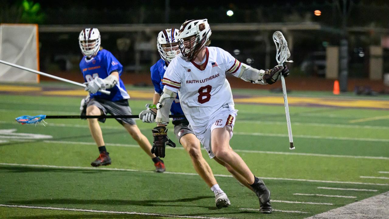 A Faith Lutheran boys lacrosse player carries the ball in a game against Bishop Gorman.