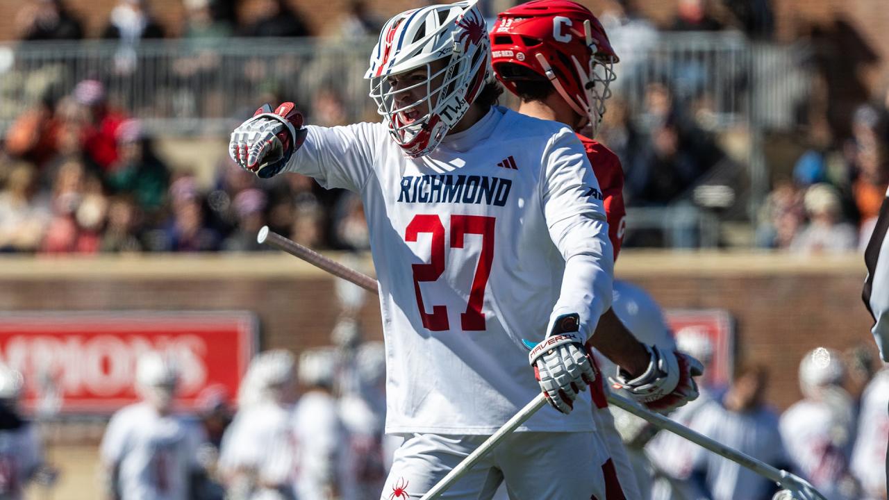 Richmond's Lucas Littlejohn raises his arm during a game against Cornell.