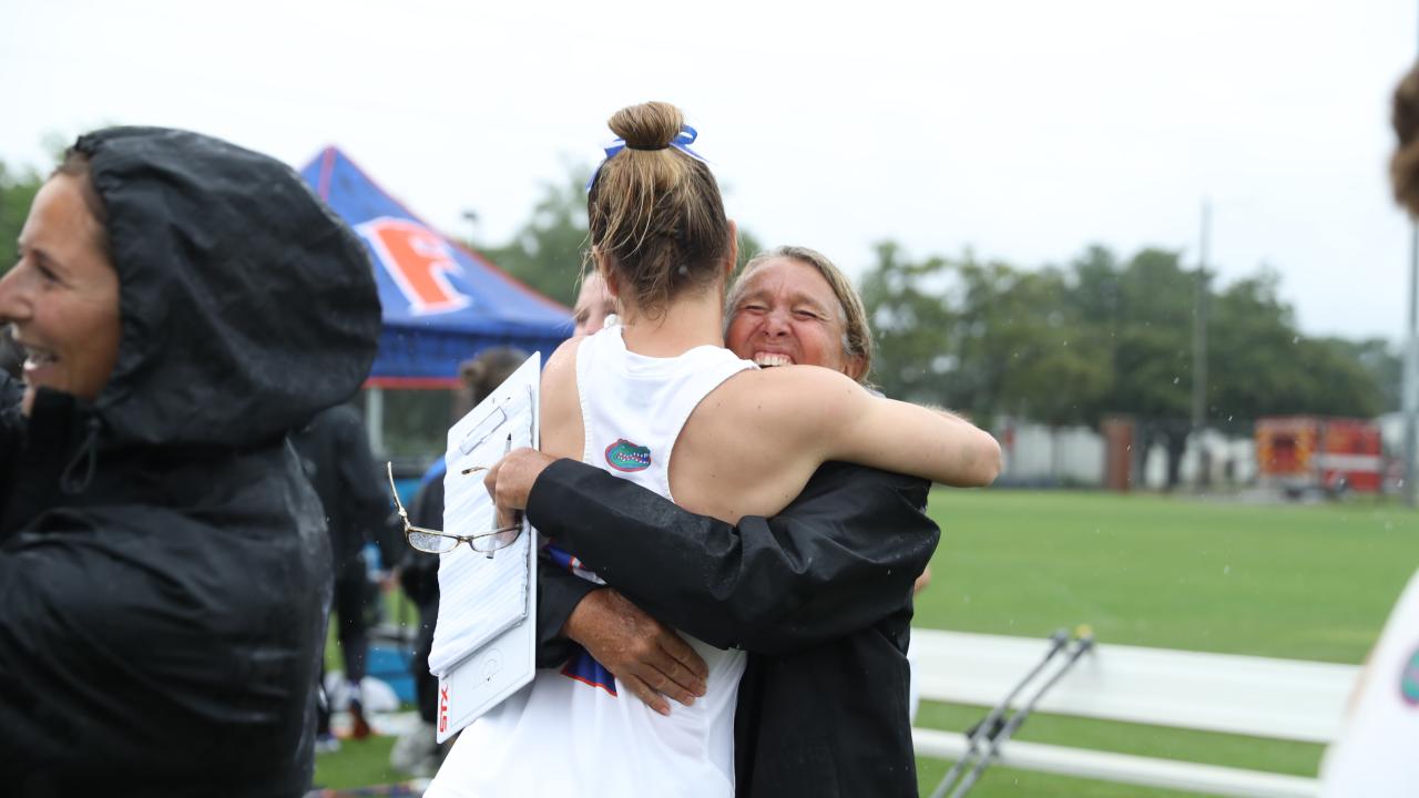 Florida women's lacrosse coach Amanda O'Leary hugs one of her players during the celebration of the Gators' NCAA tournament second-round double-overtime win over Stanford at Dizney Stadium.