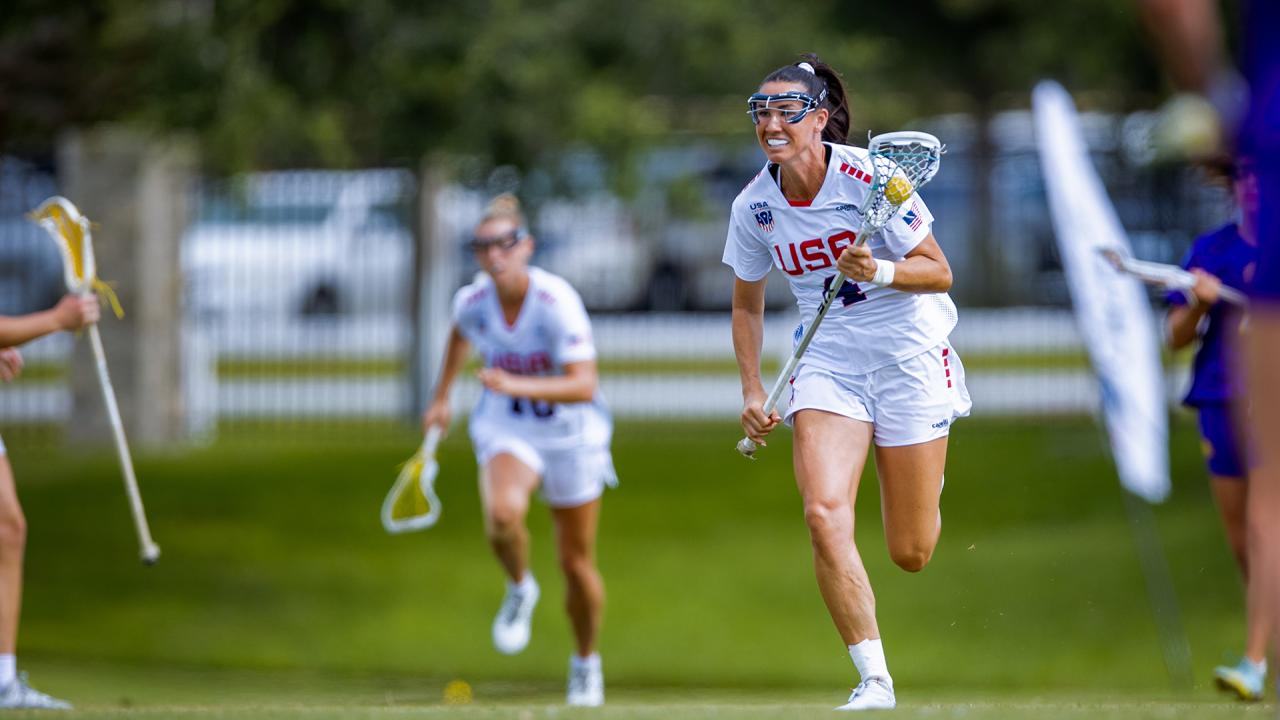 Marie McCool runs upfield with the ball against the Haudenosaunee during Sunday's PALA semfinal
