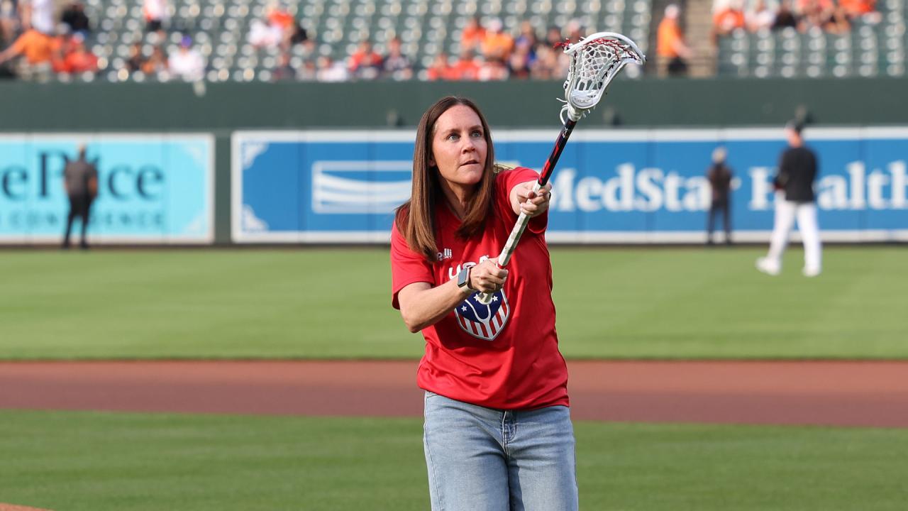 U.S. Sixes coach Lindsey Munday throws the first pitch at an Orioles game