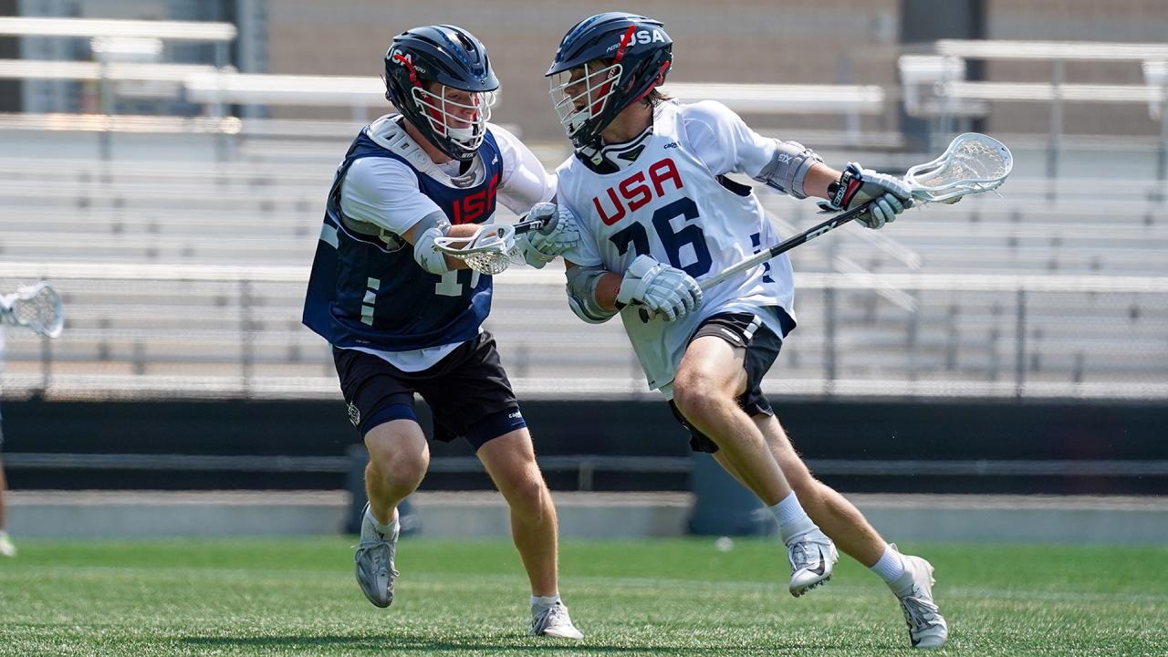 Rhett Chambers drives against Charlie Packard during a recent USA Lacrosse training camp.