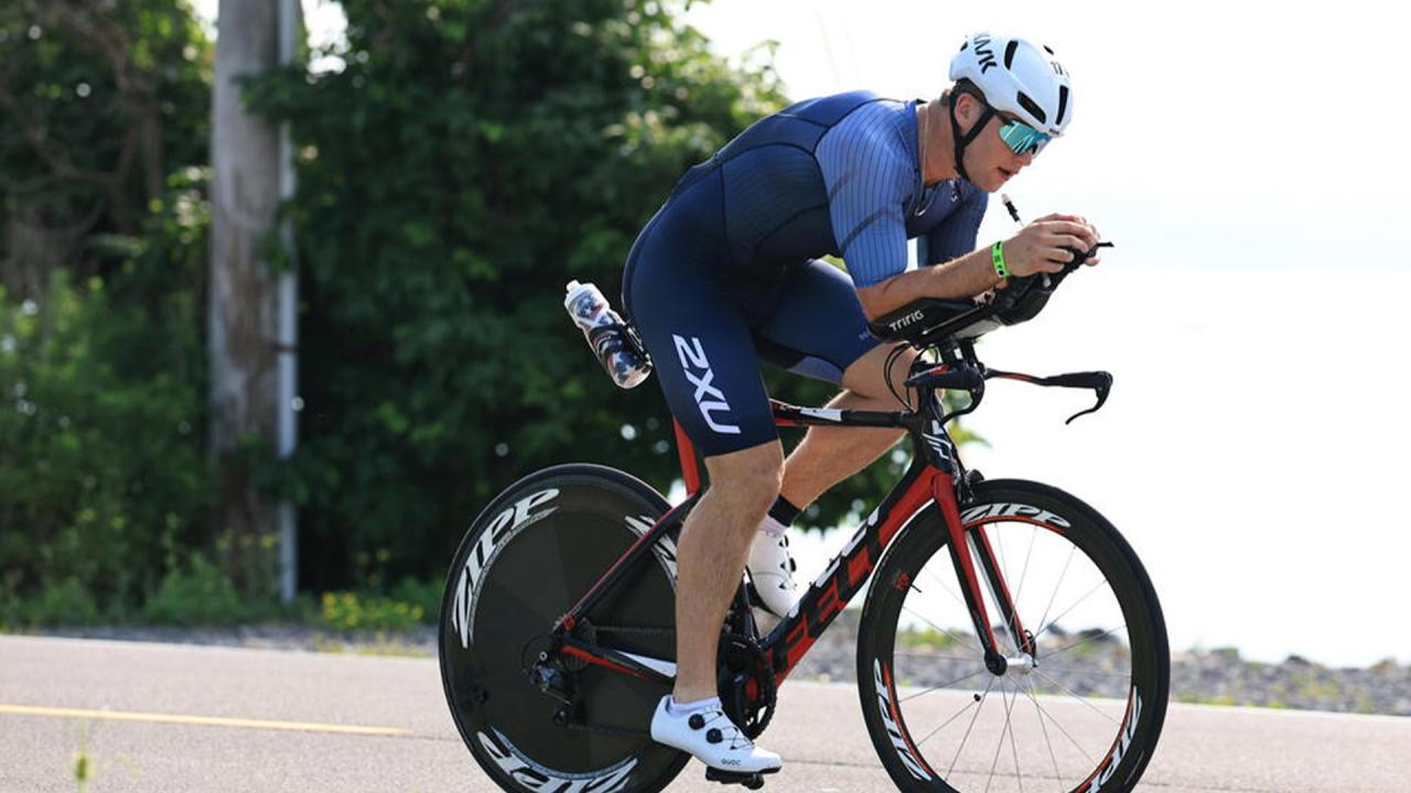 Brady Wambach biking during a half Ironman