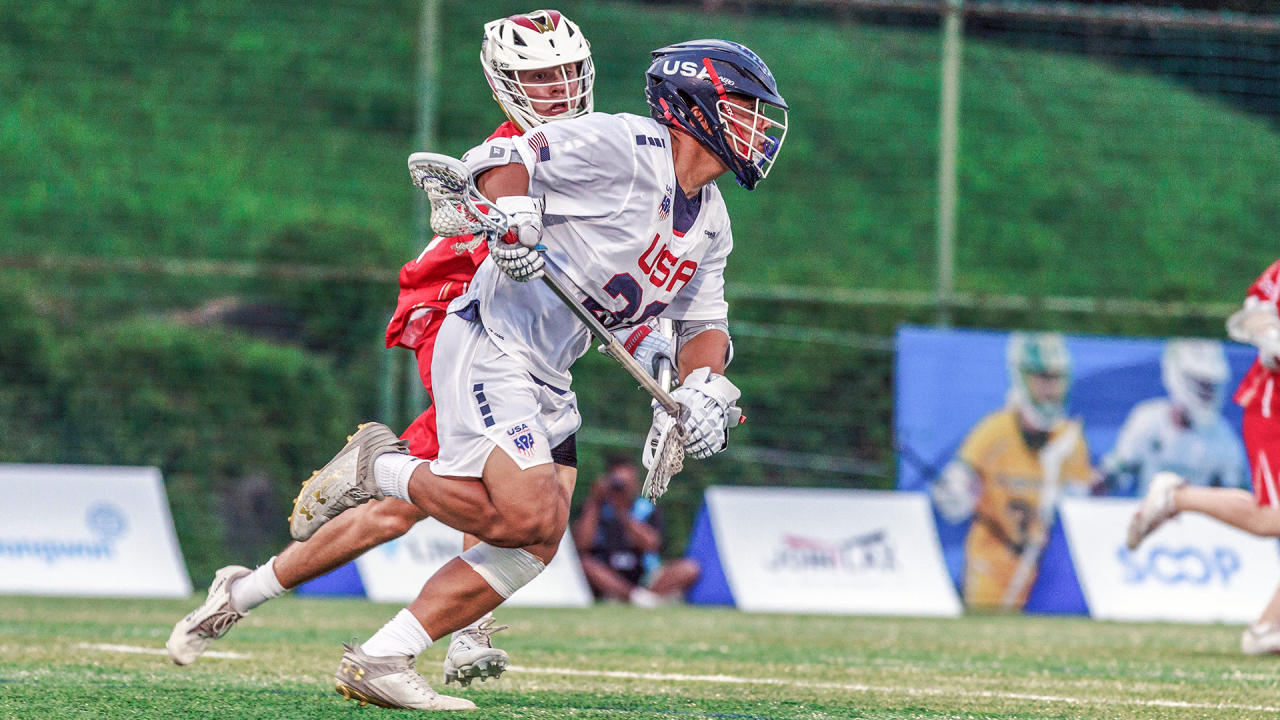 Zach Hayashi controls possession during the World Lacrosse Men's U20 Championship quarterfinals against England