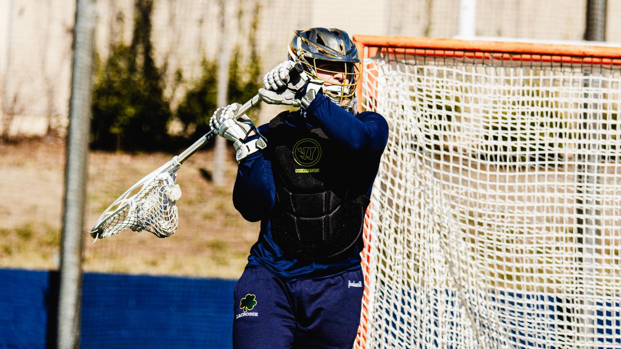 Image of Notre Dame lacrosse goalie throwing an outlet pass