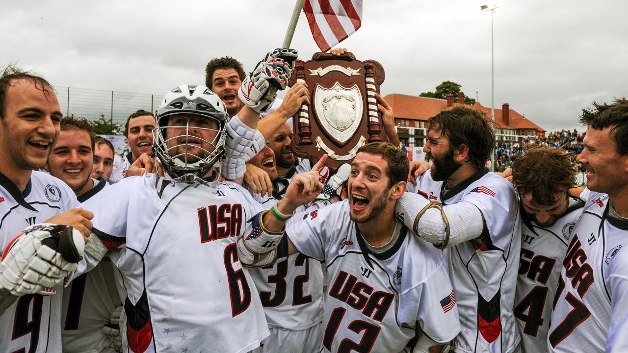 Ned Crotty signals No. 1 beneath the Turnbull Shield as the 2010 U.S. Men's National Team celebrates after beating Canada for the world championship in Manchester, England.
