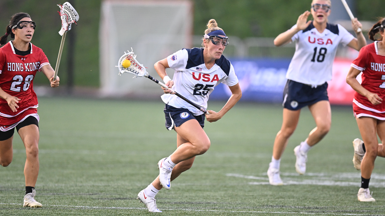 U.S. Women's National Team defender Lizzie Colson run up the field with the ball during a 2022 World Lacrosse Women's Championship contest against Hong Kong in Towson, Md.