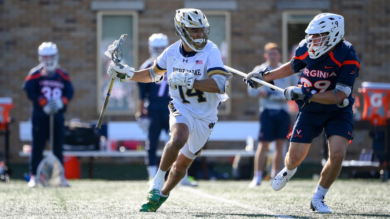 Jordan Faison drives with the ball against Virginia