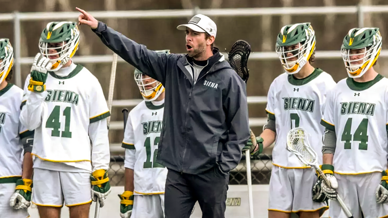 Siena men's lacrosse coach Tim Cox calls out a play from the sideline