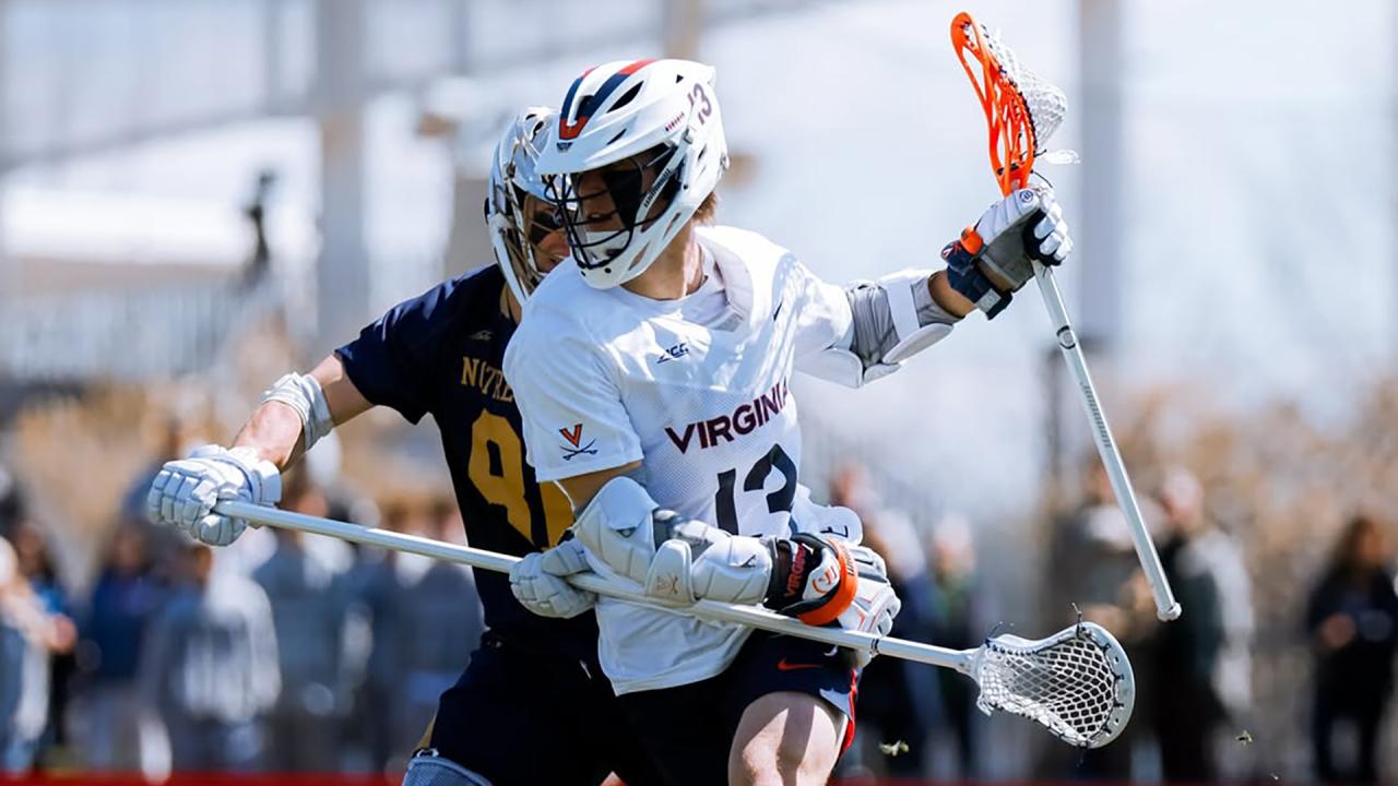 Virginia's Ryan Colsey protects the ball while guarded by a Notre Dame defender.