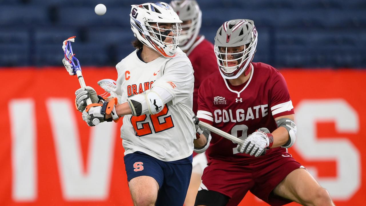 Joey Spallina throws a behind the back pass as he sets the Syracuse school record for career points