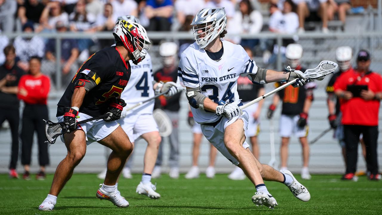 Maryland and Penn State players on the lacrosse field