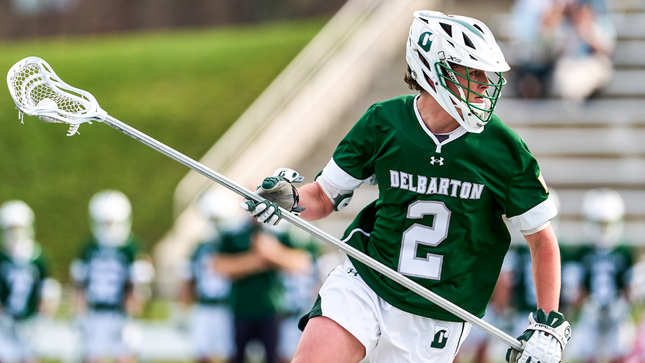 Long-stick midfielder Michael Roelke of Delbarton (N.J.) lacrosse carries the ball up the field in his stick.