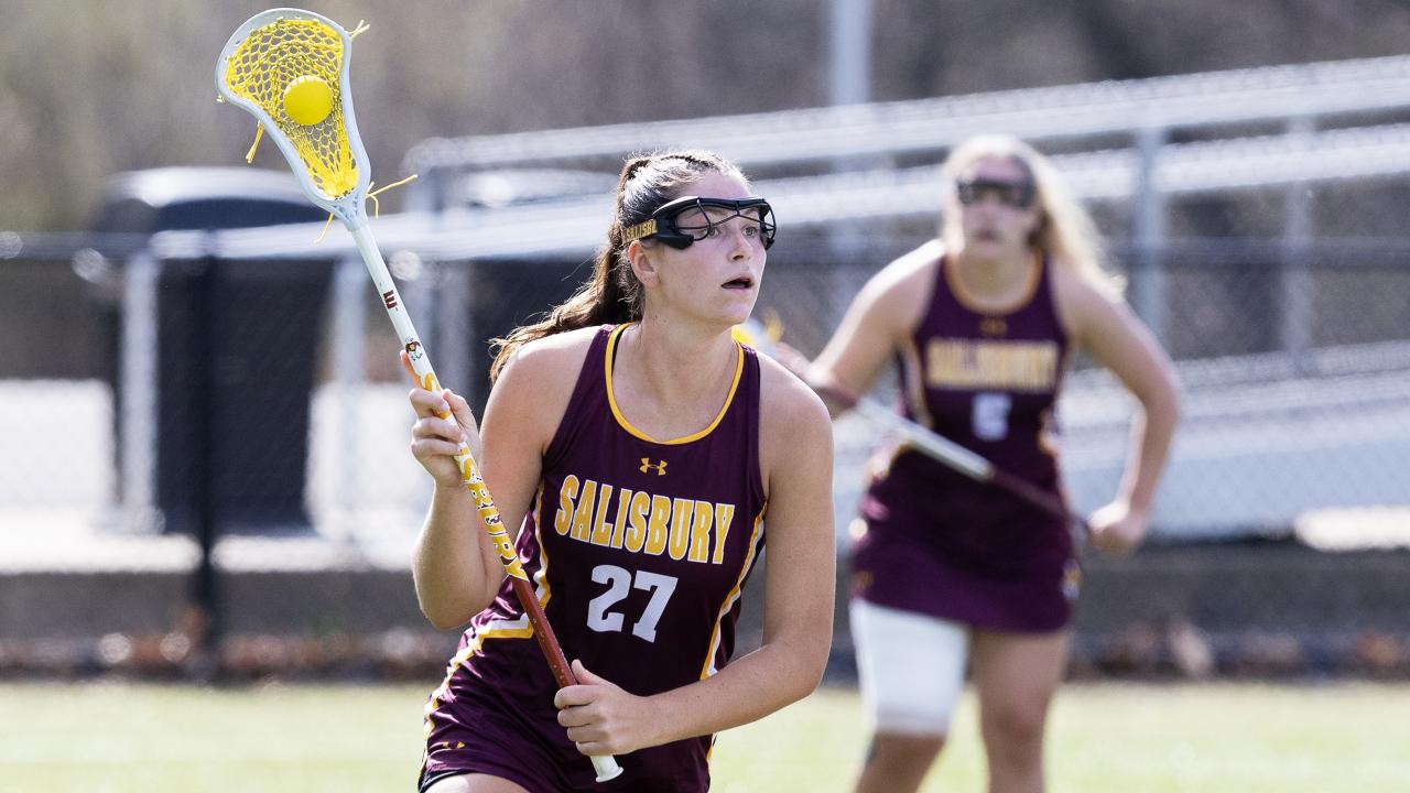 Salisbury attacker Audrey Harrington looks up field with ball in stick during a game at Neumann.