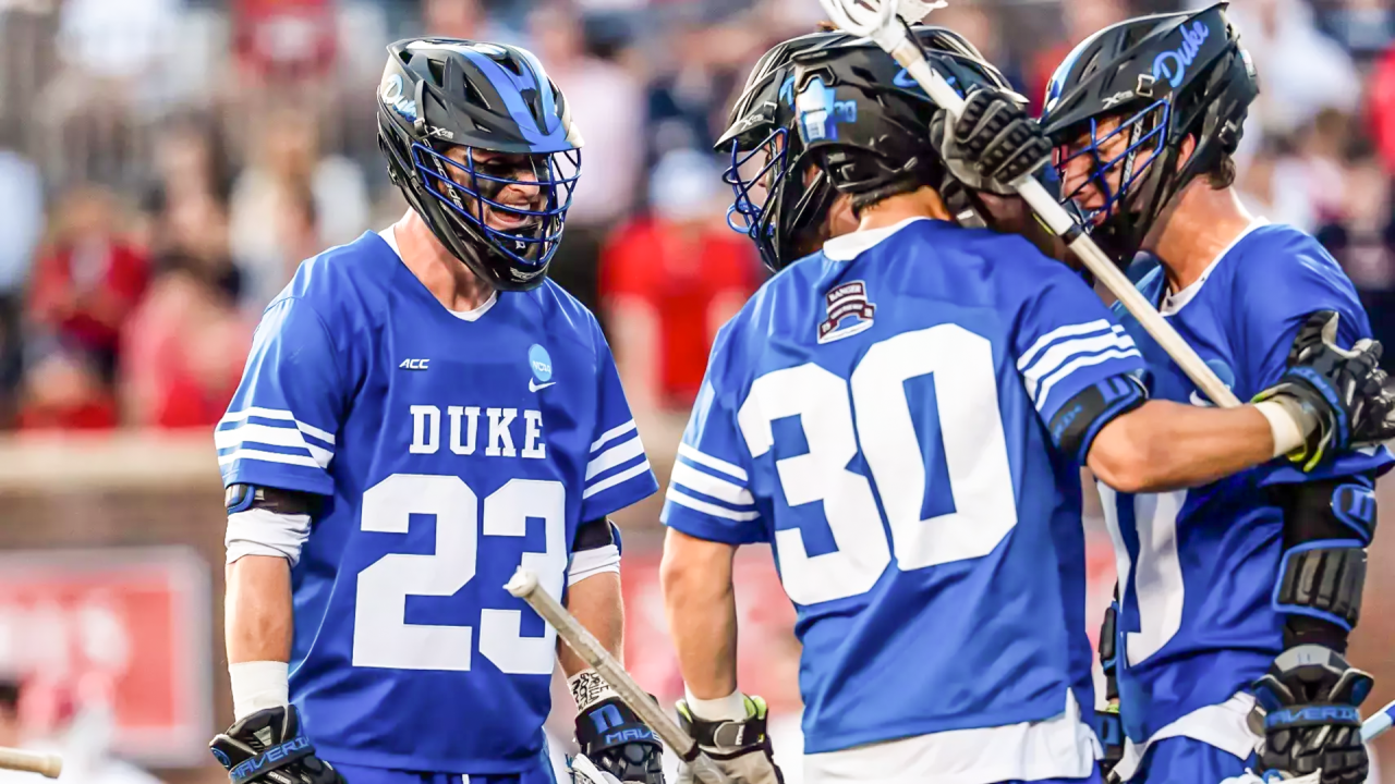 Aidan Maguire's Duke lacrosse teammates come to celebrate with him after an open-net goal against the 10-man ride at Richmond.