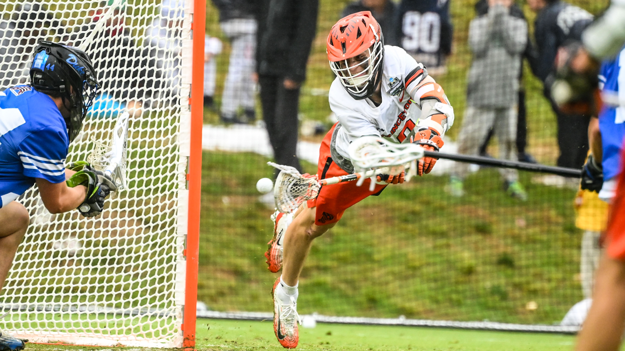 Princeton's Colin Burns swopps in for a diving backhand goal against Duke goalie Buck Cunningham in the NCAA semifinals at Scott Stadium in Charlottesville, Va.