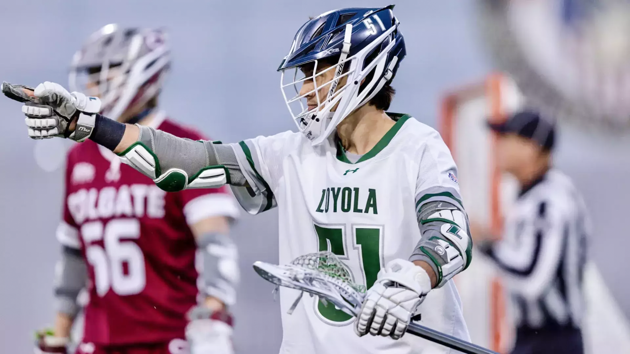 Mason Cook points to a teammate to celebrate one of his seven goals in the Patriot League semifinals against Colgate in West Point, N.Y.