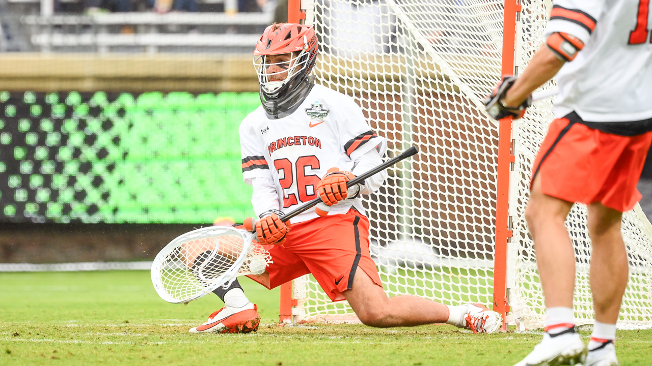 Princeton's Ryan Croddick ranges to the ground to make a save against Duke in the NCAA semifinals at Scott Stadium in Charlottesville, Va.