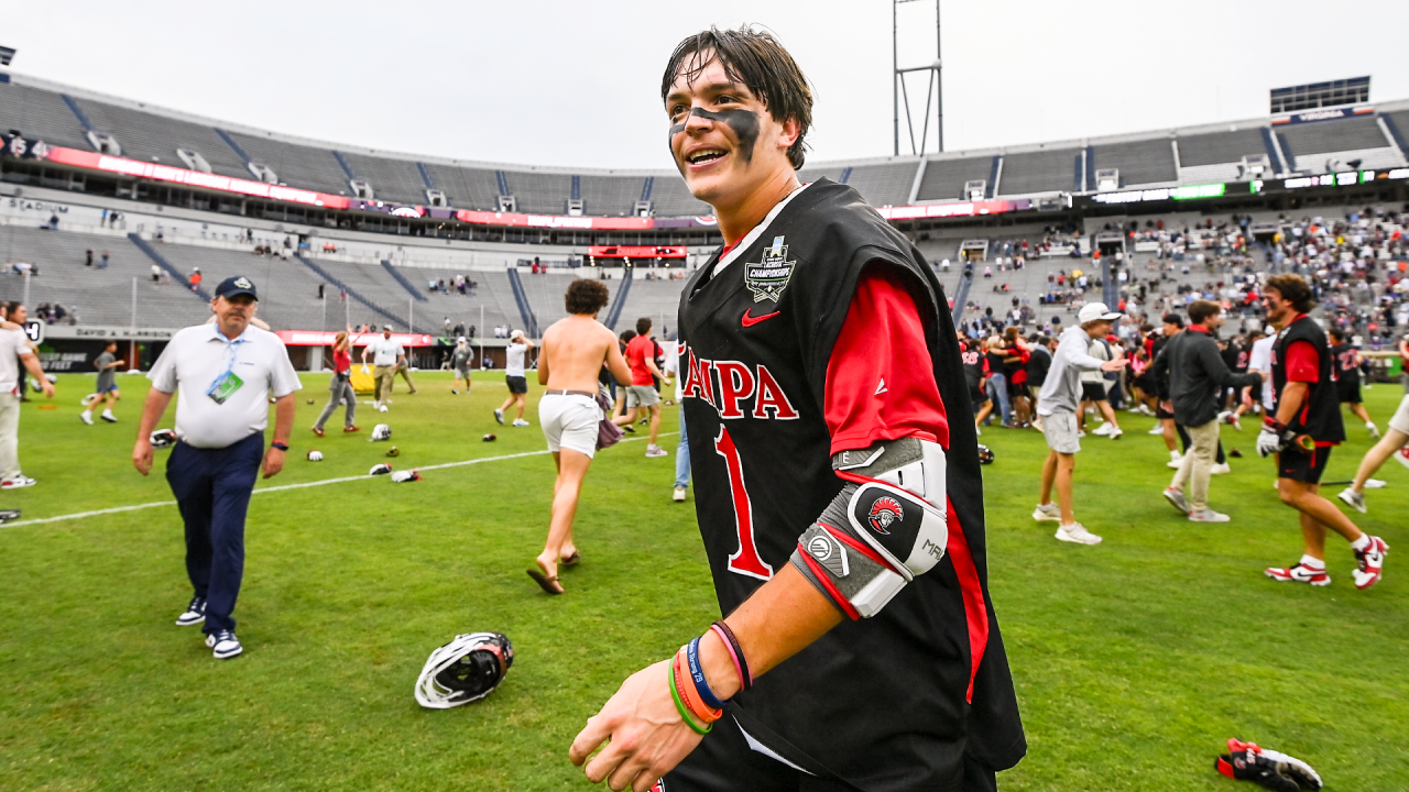 OT hero Tommy Ortega basks in the post-game celebration at Scott Stadium after Tampa's victory over Adelphi in the NCAA DIvision II championship game in Charlottesville, Va.