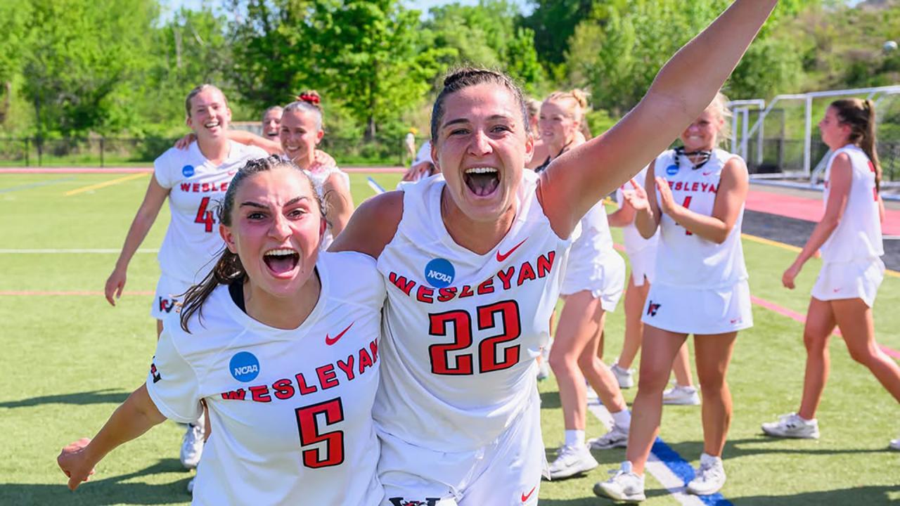 Wesleyan's Lindsey Diomede and Lilly Stoller yell to the camera following a NCAA tournament win.