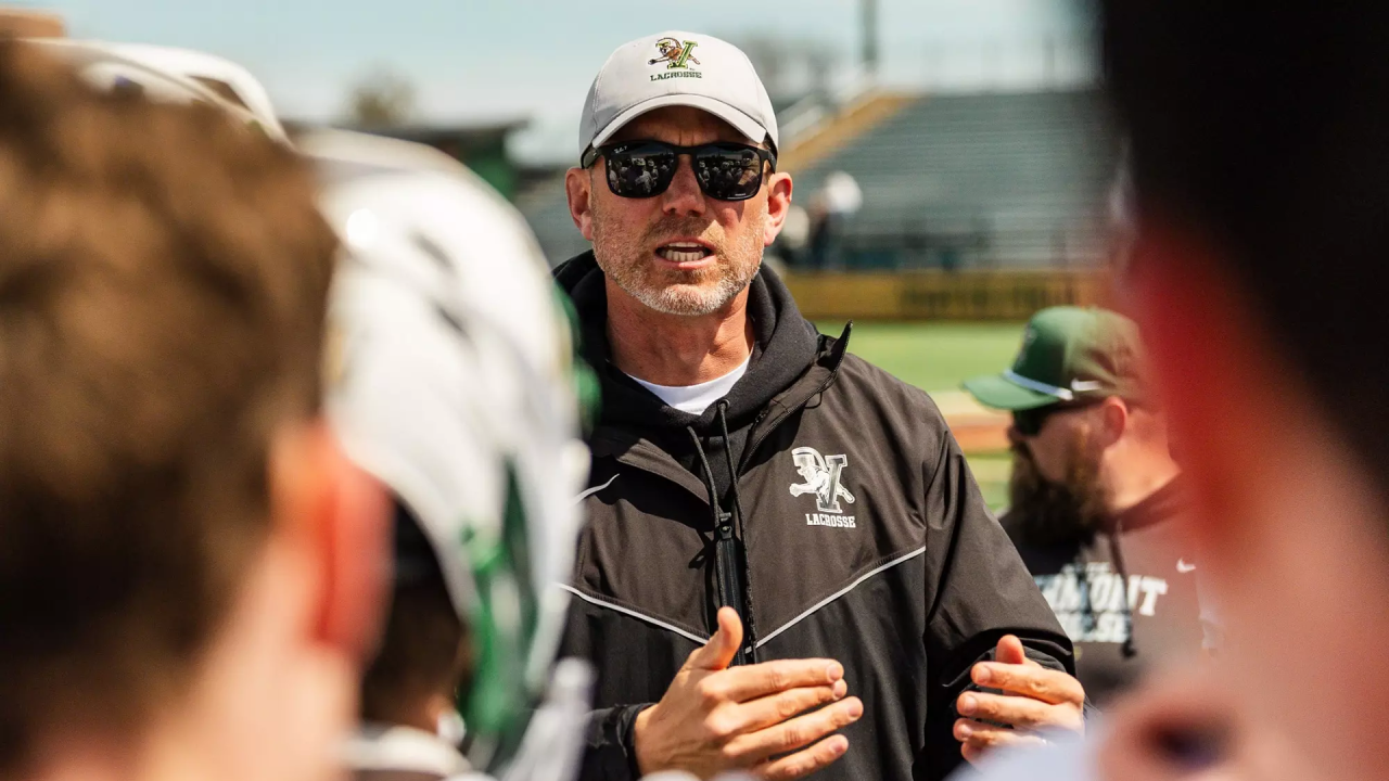 Former Vermont men's lacrosse coach Chris Feifs in the huddle