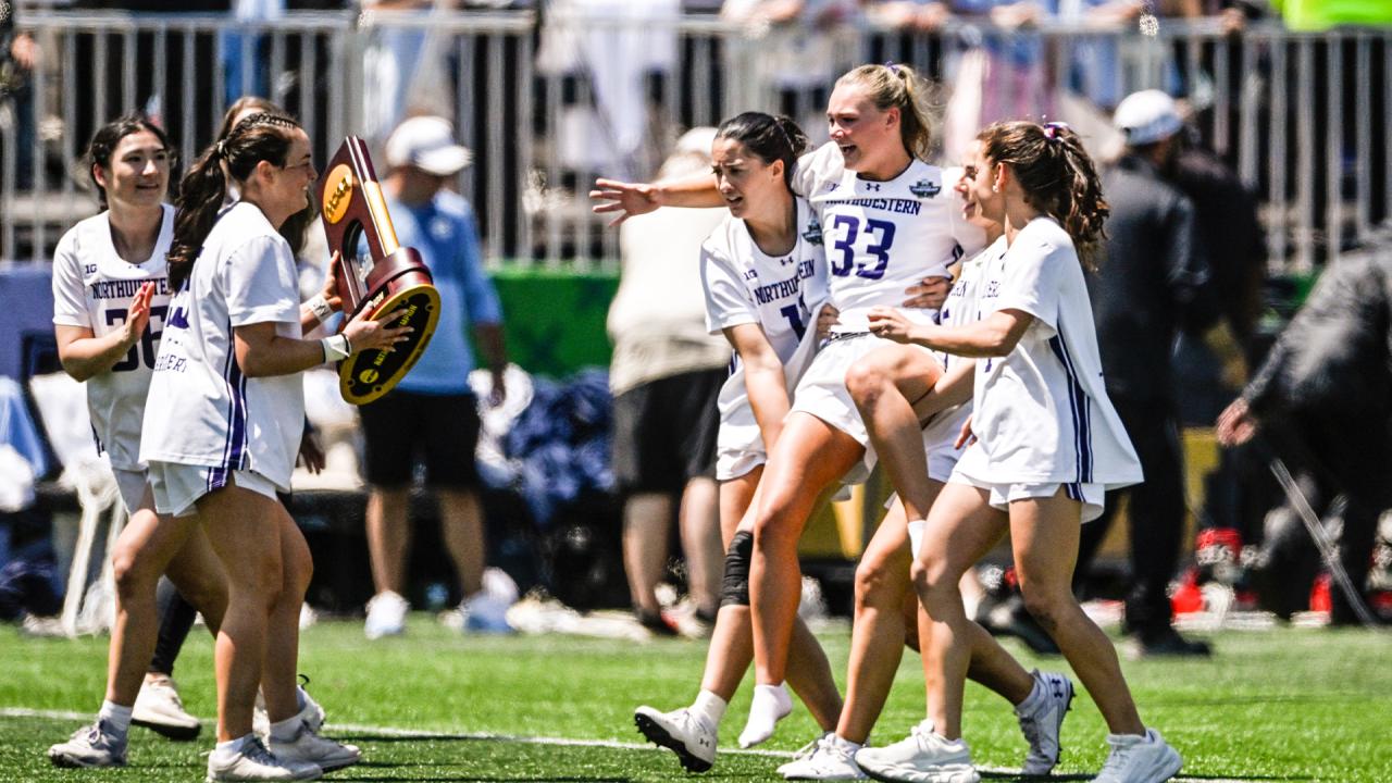 Northtwestern's Lucy Munro is carried on the field by teammates