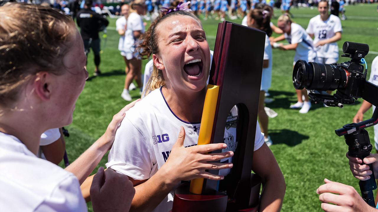 Northwestern's Madison Taylor hugs the championship trophy