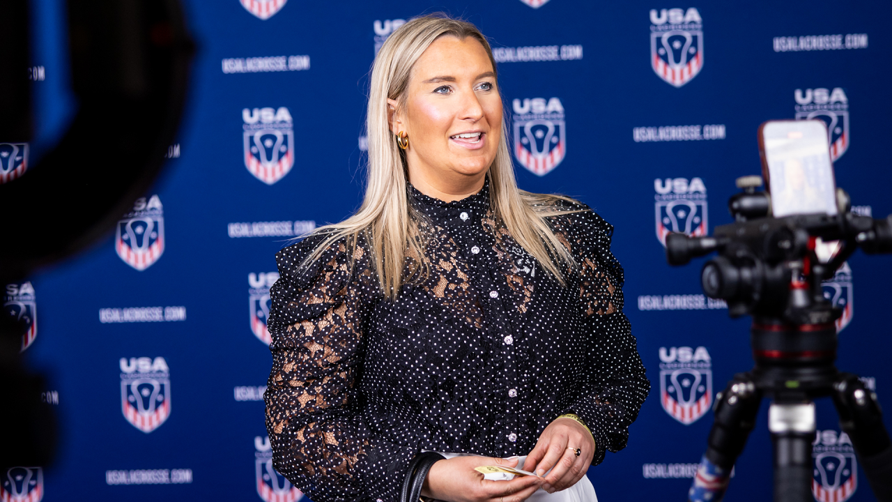 Natalie Wills in front of USA Lacrosse backdrop