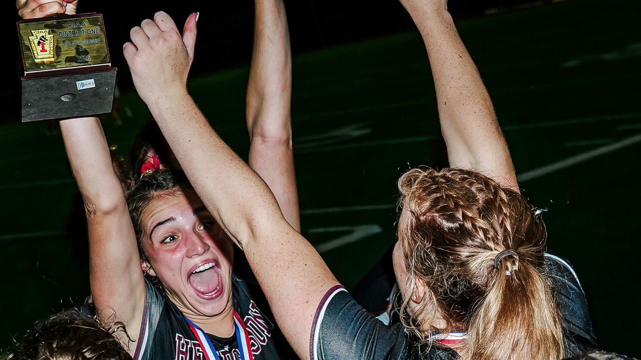 West Chester Henderson (Pa.) girls' lacrosse players celebrate their district title win over Conestoga (Pa.).