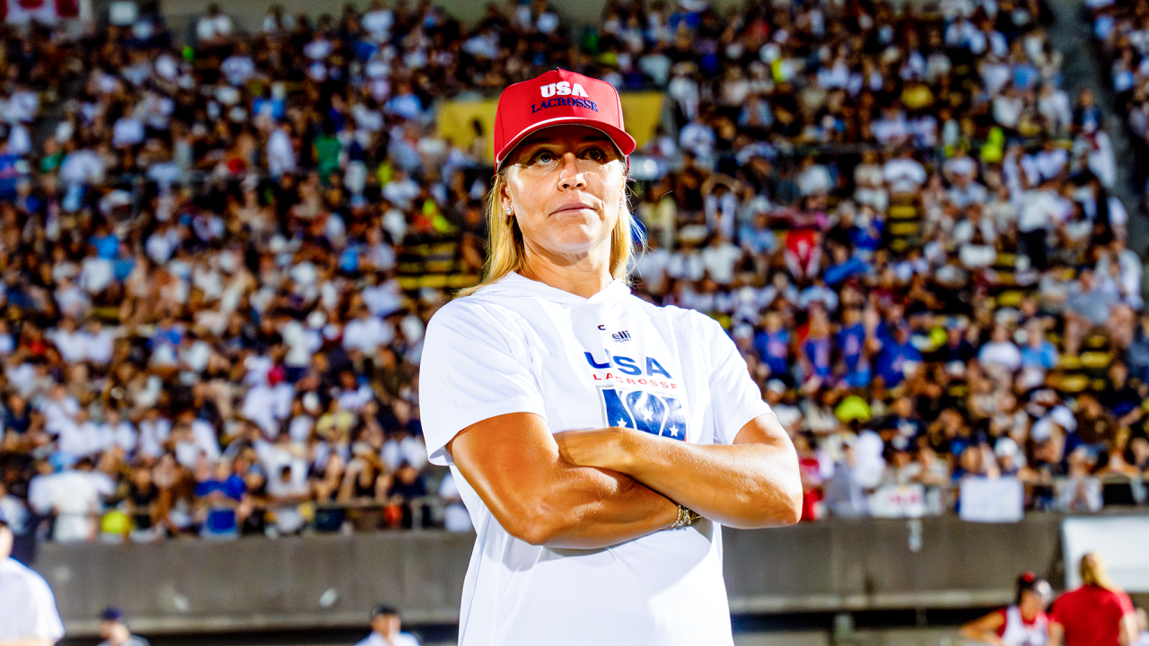 U.S. Women's National Team head coach Acacia Walker-Weinstein looks on, as do 3,000-plus fans at Prince Chichibu Stadium in Tokyo, Japan, where the U.S. defeated Canada 16-4 in the World Lacrosse Women's Championship gold medal game.