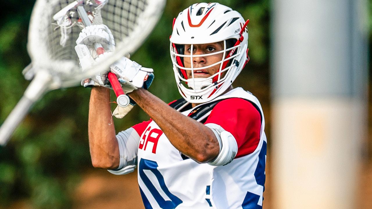 USA defenseman Shawn Lyght makes a pass to the goalie during men's field training camp in Charlotte, N.C.